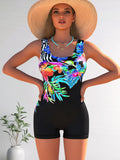 Azuretideswimwear Black one-piece women’s swimsuit with blue cartoon print – figure-hugging cut